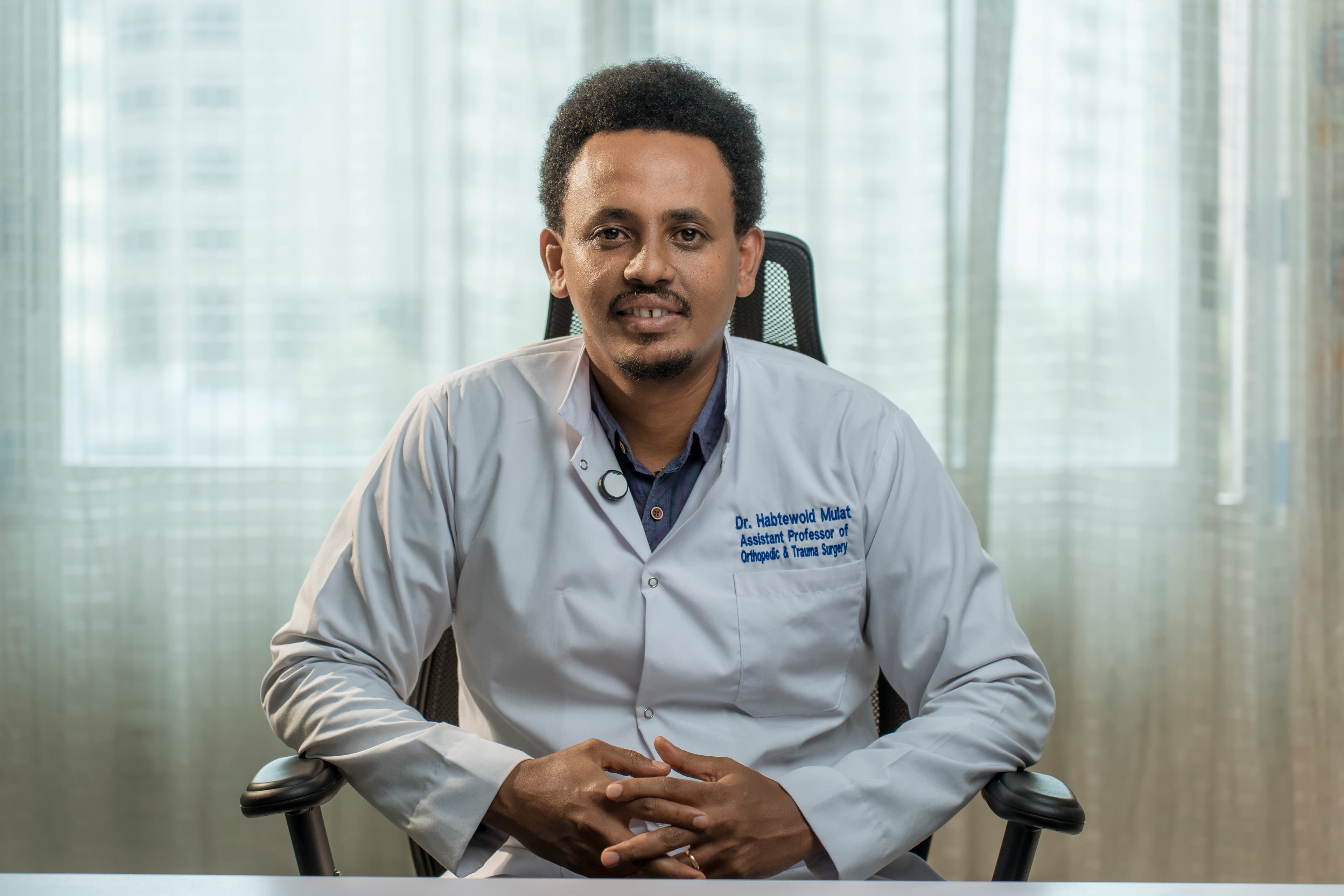 Dr. Habtewold Mulat in surgical attire
